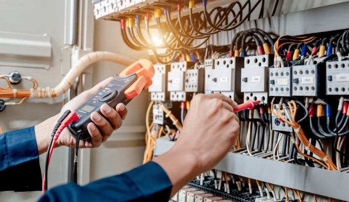 A person is doing electrical repairs