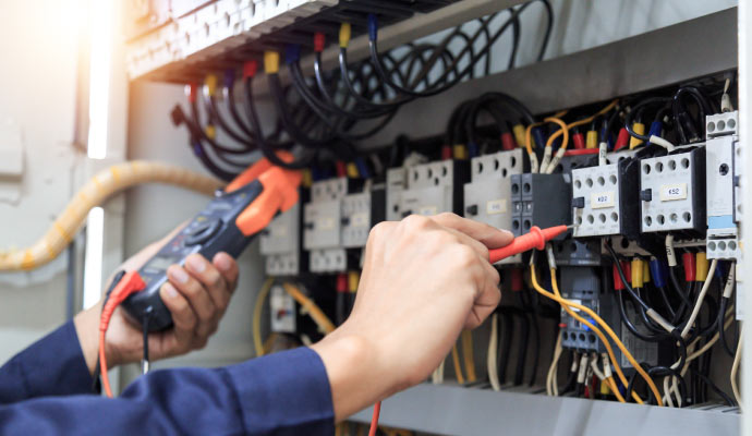 Person upgrading electrical system with equipment