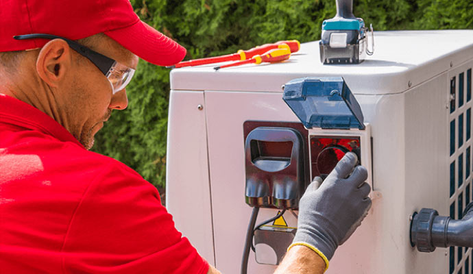 A person is installing a generator