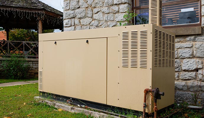 A clean generator installed outside a building. 