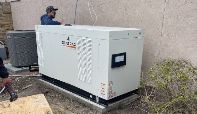 A person is repairing a generator