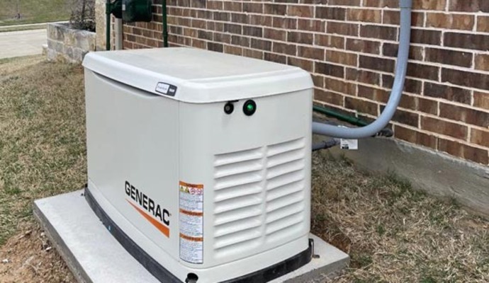 Installed generac generator beside house.