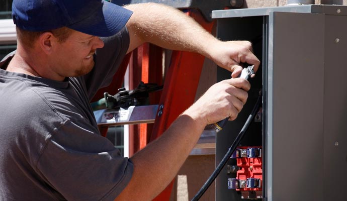 Expert repairing home electrical system.